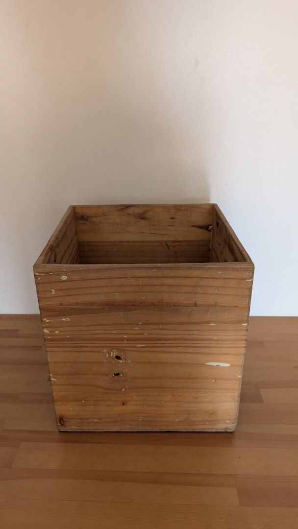 Wooden Storage Box Container Crate (Category: Storage Boxes & Baskets) located in Manila. Submitted by decluttering_9917354 (Listing ID 1445104750, Image 1). Description: - Solid wood box - Square shape - Ideal for vinyl storage - Rustic charm with signs of wear and tear - Approximate measurements: 15" x 15" x 15" - Ready for a new home.