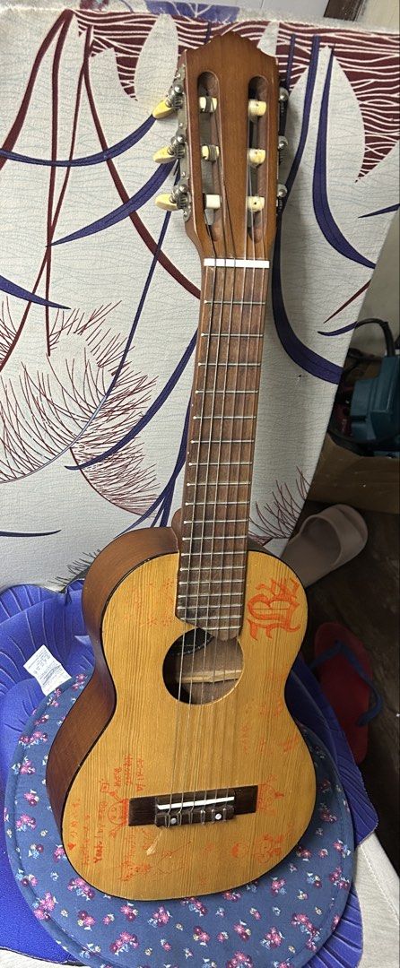 Yamaha Guitarlele GL1 (Category: Musical Instruments) located in Caloocan City. Submitted by guitara1822 (Listing ID 1445049691, Image 1). Description: Guitarlele GL1 Yamaha Design: A unique 6-string nylon guitar sized like a baritone ukulele (17” scale).Tuning: Standard tuning is pitched up to A (A/D/G/C/E/A), which is a 4th higher than a standard guitar.Materials: Features a spruce top, meranti back and sides, and a rosewood fingerboard..