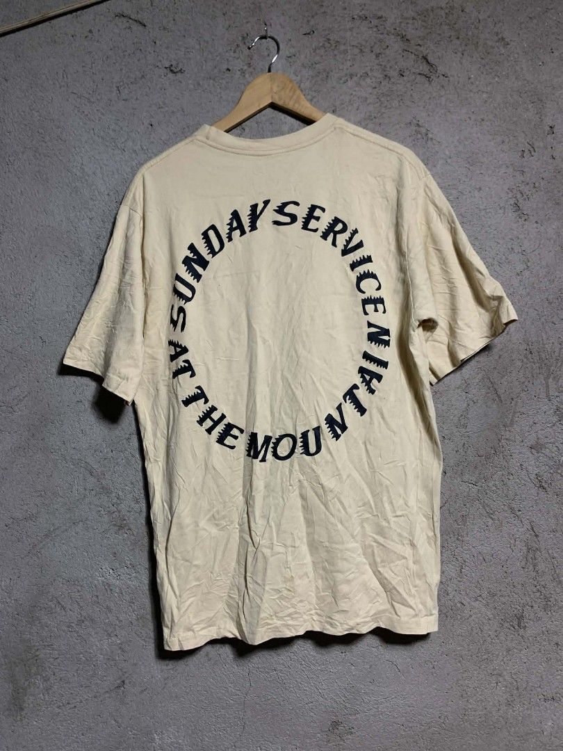 Yeezy Sunday Service At The Mountain T-Shirt (Category: Tshirts & Polo Shirts ) located in Manila. Submitted by gentlemountain.32545c (Listing ID 1445192828, Image 1). Description: - Authentic Yeezy Cream T-Shirt - Size: Large (L) - Front Graphic: 'Trust God' - Back Graphic: 'Sunday Service At The Mountain April 21 2019' - Material: 100% Cotton - Ideal for Yeezy and Kanye West fans.