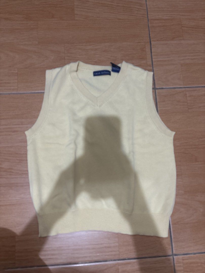 Yellow V-Neck Sweater Vest Top (Category: Sleeveless) located in Las Pinas. Submitted by bellagvr (Listing ID 1445193590, Image 1). Description: - Classic yellow V-neck sweater vest - Sleeveless design, ideal for layering - Ribbed hem and neckline for a neat finish - Versatile for casual or smart casual styling.