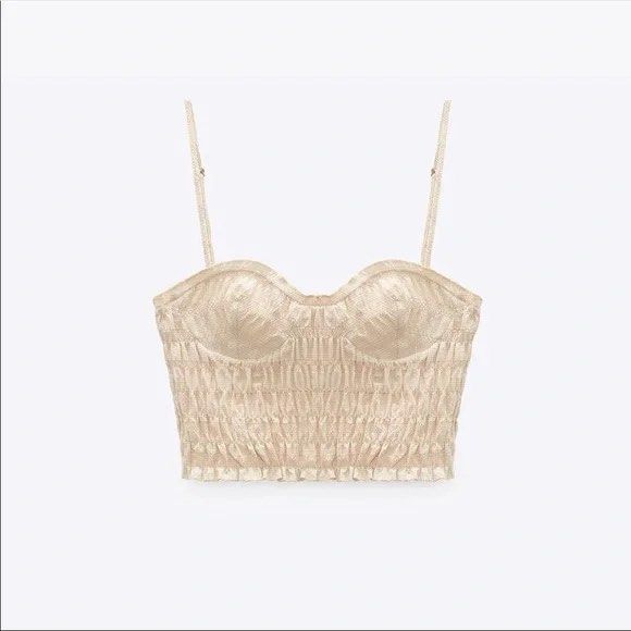 Zara Smocked Bustier Crop Top Beige Size M (Category: Sleeveless) located in Naga. Submitted by fashownts (Listing ID 1445085721, Image 1). Description: - Zara beige smocked bustier crop top - Size: Medium - Adjustable straps - Worn only once - Versatile: pairs well with skirts or high-waisted pants - Ideal for summer outings or nights out.