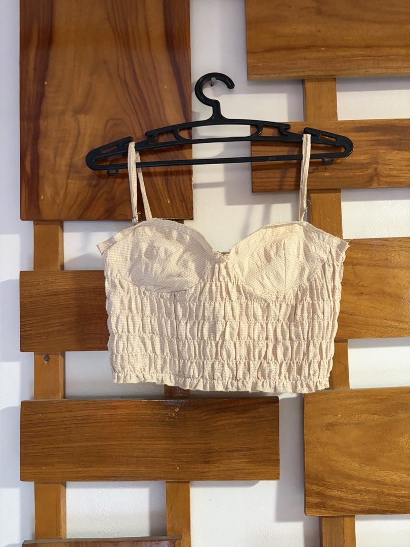Zara Smocked Bustier Crop Top Beige Size M (Category: Sleeveless) located in Naga. Submitted by fashownts (Listing ID 1445085721, Image 3). Description: - Zara beige smocked bustier crop top - Size: Medium - Adjustable straps - Worn only once - Versatile: pairs well with skirts or high-waisted pants - Ideal for summer outings or nights out.