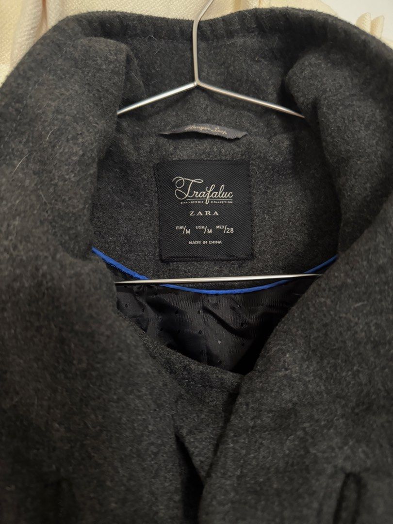 SALE ZARA Trafaluc Double Breasted Grey Wool Blend Peacoat (Category: Coats, Jackets and Outerwear) located in Manila. Submitted by mariatambien (Listing ID 1445093438, Image 2). Description: - ZARA Trafaluc grey double-breasted coat - Stand-up collar - Button closure - Two front pockets - Fully lined interior with blue trim detail - Ideal for cooler weather.