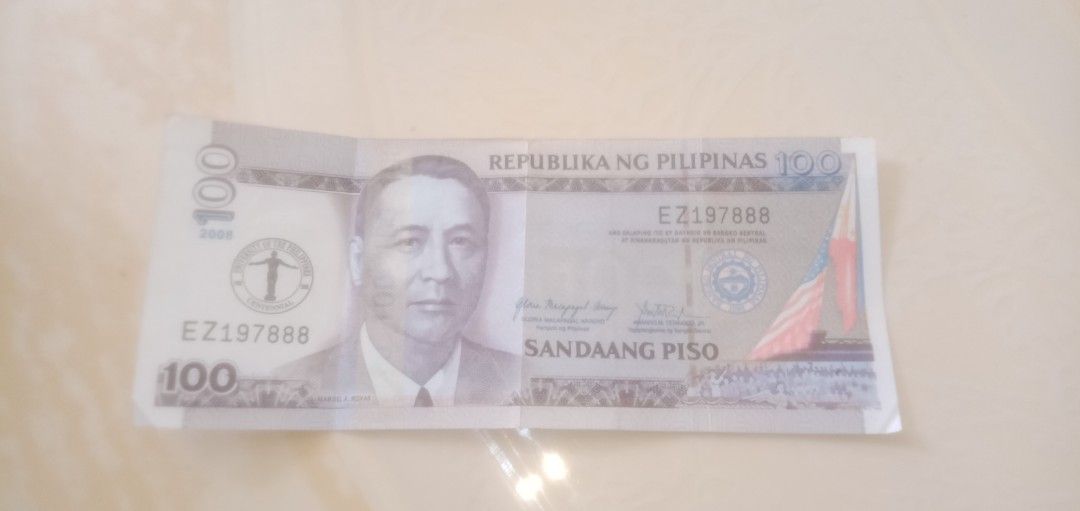 100 Philippine Peso Bill UP Centennial Commemorative (Category: Currency) located in Caloocan City. Submitted by teamgoodbuys (Listing ID 1445290054, Image 1). Description: - Authentic 100 Peso Bill from the Republic of the Philippines. - UP Centennial Commemorative - Features a portrait of a notable Filipino figure. - Showcases the vibrant Philippine flag. - Unique serial number: EZ197888. - Ideal for coin and currency collectors. - Makes a grea