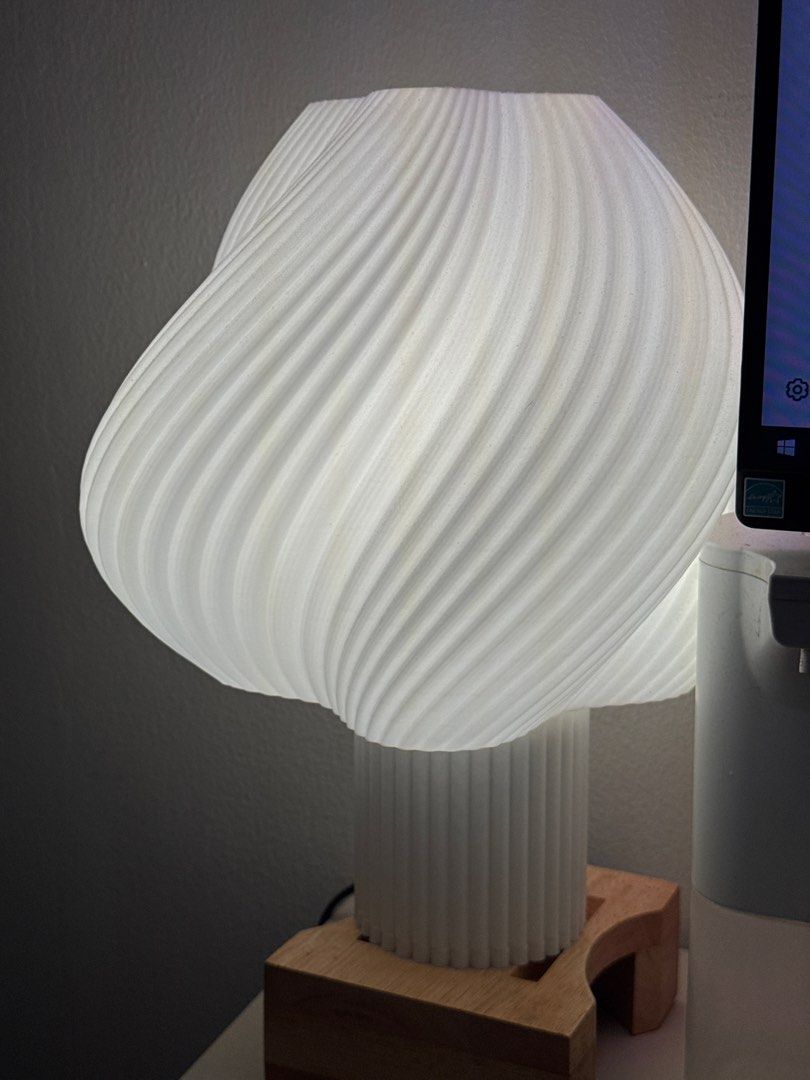 3D printed lamp | Unique Swirl Design Table Lamp (Category: Lighting) located in Antipolo. Submitted by abc__mart (Listing ID 1445300514, Image 1). Description: - Unique swirl design table lamp - Ribbed texture shade for beautiful light effects - Ribbed base - Simple wooden stand - Adds ambiance to any room - Perfect for bedside table or desk.