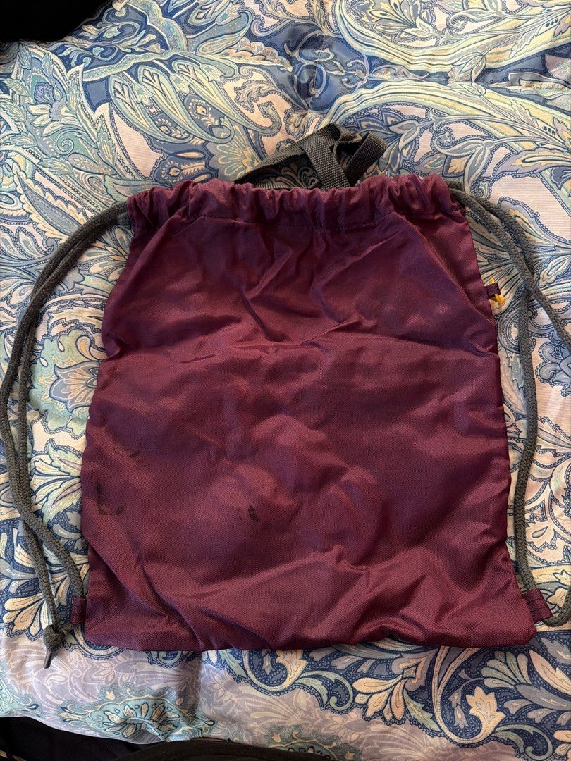 Adidas Gym Bag (Category: Backpacks) located in Manila. Submitted by tjsells.101 (Listing ID 1445308101, Image 2). Description: - Burgundy Adidas drawstring bag - Classic trefoil logo on front - Large Adidas graphic with three stripes - Made with fine quality fabric - Drawstrings in good working condition - Ideal size for gym or everyday use - with Pouch - has stains kn the back but not noticeable when used.