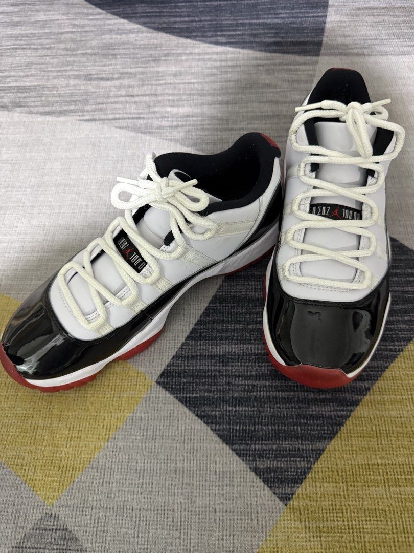 Air Jordan 11 Retro Low Concord Bred (Category: Sneakers) located in Taguig. Submitted by jocher74605 (Listing ID 1445249341, Image 3). Description: New. No box. I’m a collector. - Classic Jordan 11 Lows - Colorway: White, black patent leather, and red sole - Light cream laces - Essential addition to any sneaker collection - A must-have item.