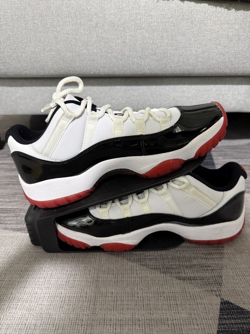Air Jordan 11 Retro Low Concord Bred (Category: Sneakers) located in Taguig. Submitted by jocher74605 (Listing ID 1445249341, Image 1). Description: New. No box. I’m a collector. - Classic Jordan 11 Lows - Colorway: White, black patent leather, and red sole - Light cream laces - Essential addition to any sneaker collection - A must-have item.