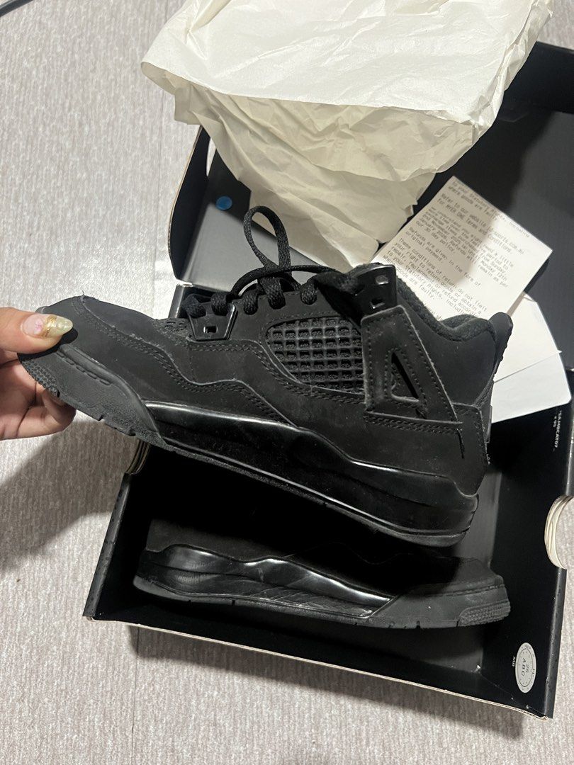 Air Jordan 4 Retro Black Cat (Category: Babies & Kids Fashion) located in Makati City. Submitted by ilayy (Listing ID 1445417676, Image 2). Description: - Authentic Black Cat Jordan 4s - Sleek all-black colorway - Comes with original box and paper - A must-have for any sneaker collection - Size clearly visible on the inner tag.