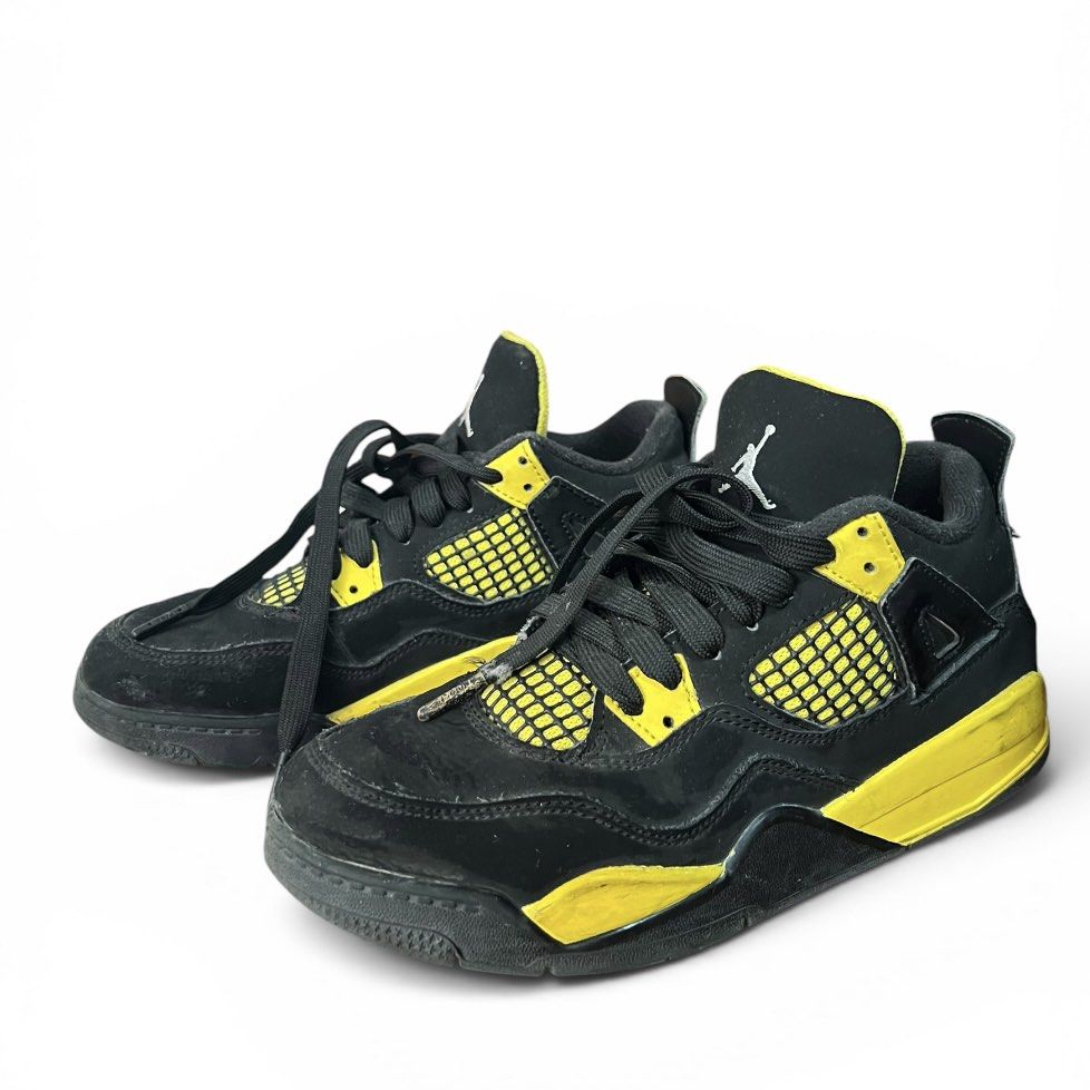 Air Jordan 4 Retro "Thunder" (Black/Yellow) (Category: Babies & Kids Fashion) located in Cavite. Submitted by ch_selling (Listing ID 1445397673, Image 2). Description: Product Details: Model: Air Jordan 4 Retro “Thunder” Colorway: Black / Tour Yellow Size: US 3Y, UK 2.5, EUR 35 Condition: 6/10 (Well Used). Nubuck uppers are still intact and look good from the top. However, please note that the yellow paint on the midsoles has significant chipping