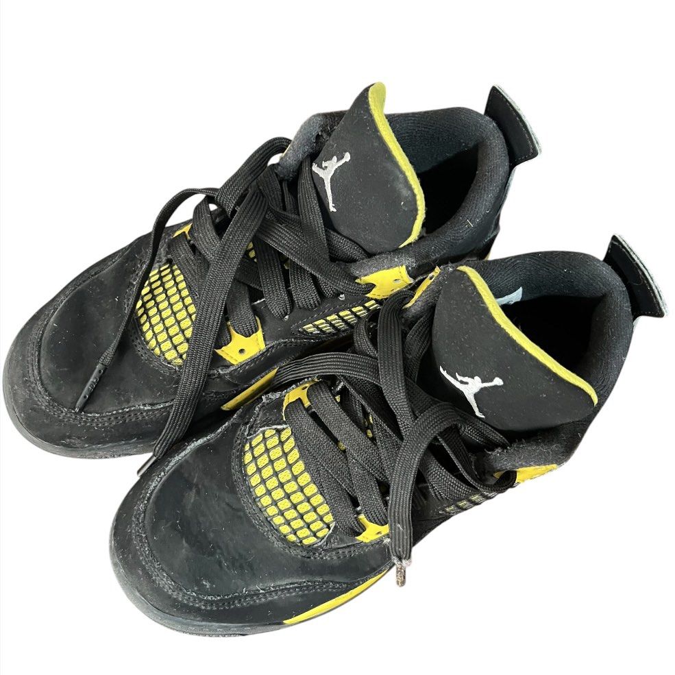 Air Jordan 4 Retro "Thunder" (Black/Yellow) (Category: Babies & Kids Fashion) located in Cavite. Submitted by ch_selling (Listing ID 1445397673, Image 3). Description: Product Details: Model: Air Jordan 4 Retro “Thunder” Colorway: Black / Tour Yellow Size: US 3Y, UK 2.5, EUR 35 Condition: 6/10 (Well Used). Nubuck uppers are still intact and look good from the top. However, please note that the yellow paint on the midsoles has significant chipping