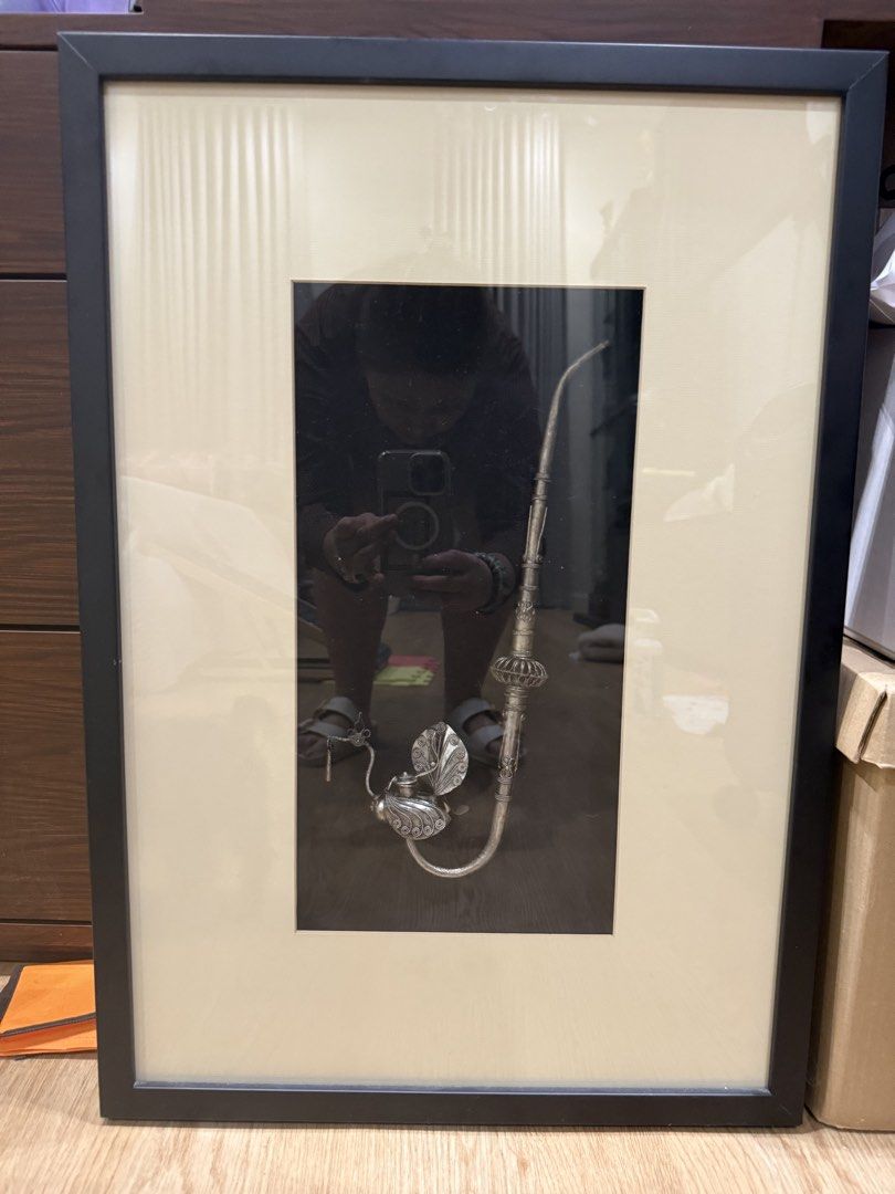 Antique Silver Pipe and Object Framed Art (Category: Frames & Pictures) located in Pasig City. Submitted by happydragon_07d654 (Listing ID 1445408724, Image 2). Description: - Framed artwork with an antique silver pipe. - Classic black frame with cream matting. - Unique decorative piece for your wall. - Guaranteed conversation starter. - [Insert dimensions here if known].