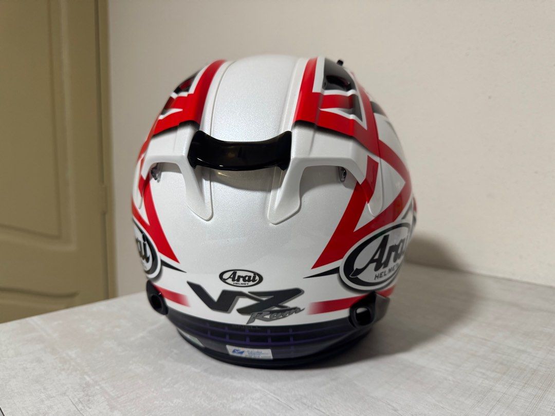 Arai VZ-RAM Helmet with Visor (Category: Motorcycle Apparel) located in Singapore. Submitted by one9eight9 (Listing ID 1445247671, Image 3). Description: - Arai VZ-RAM Helmet Nakano Star - Colour: White with Red & Black Graphic Design - Visor: Clear - Branding: YF DESIGN, Racing Specialities (on bag) - Origin: Made in Japan - wear it for two occasions - Ideal for riders I can deliver it to you with a cost depending on your location .