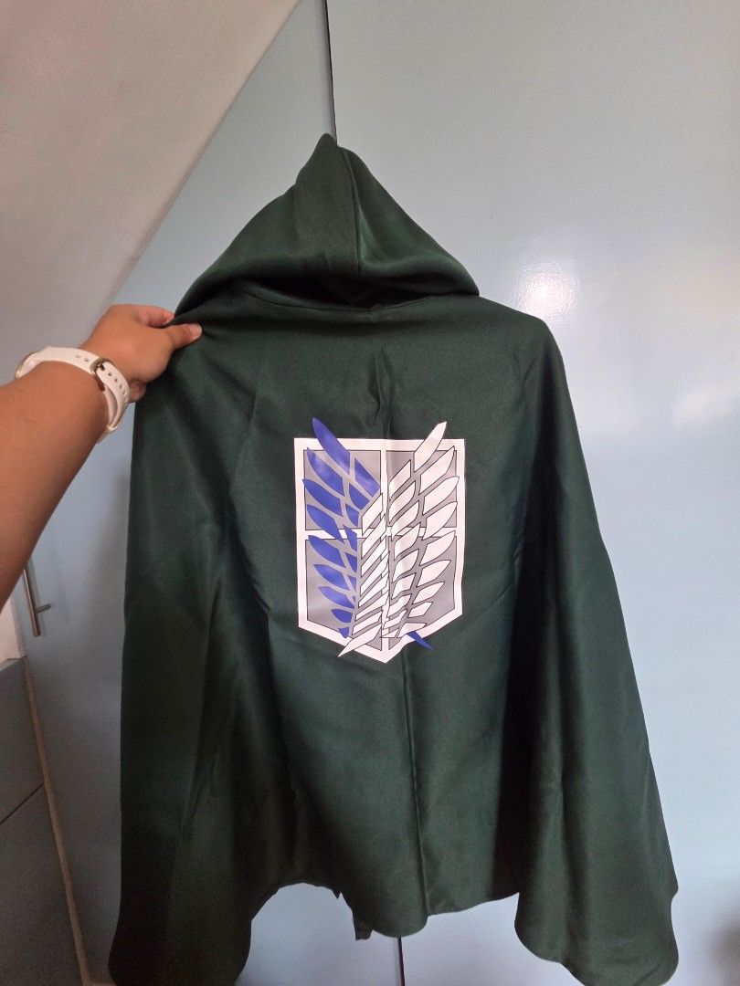Attack on Titan Survey Corps Hoodie (Category: Coats, Jackets and Outerwear) located in Santa Rosa. Submitted by arzy_ann (Listing ID 1445273668, Image 2). Description: - Green hoodie featuring the iconic Survey Corps emblem from Attack on Titan. - Estimated size: Medium to Large. - Perfect for any Attack on Titan fan. - Great for cosplay events or casual everyday wear. - Add this awesome hoodie to your collection today!.