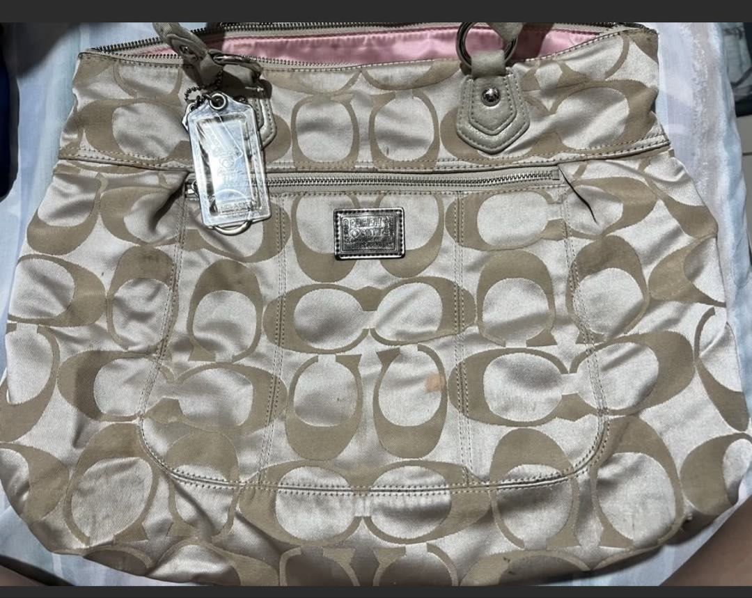 Authentic Coach Poppy Glam Tote Bag (Category: Luxury Bags & Wallets) located in Manila. Submitted by deoksun (Listing ID 1445356715, Image 1). Description: COACH Poppy Glam Tote Bag in Gold Metallic Beige 17890 Aqua Satin Lining Handle Drop 7.5” Height 13.75” Width 14.25” Depth 3” .