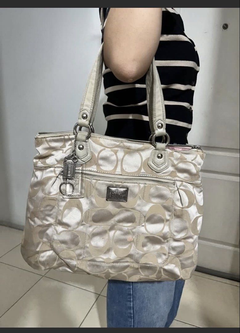 Authentic Coach Poppy Glam Tote Bag (Category: Luxury Bags & Wallets) located in Manila. Submitted by deoksun (Listing ID 1445356715, Image 2). Description: COACH Poppy Glam Tote Bag in Gold Metallic Beige 17890 Aqua Satin Lining Handle Drop 7.5” Height 13.75” Width 14.25” Depth 3” .