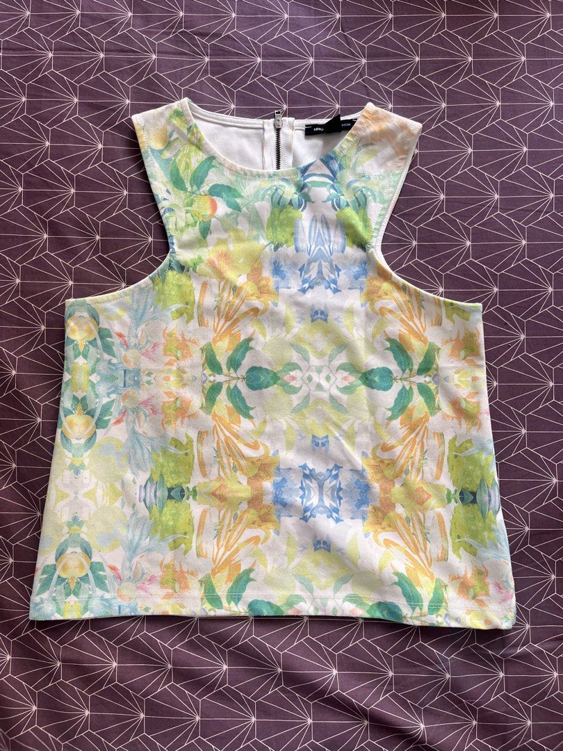 Authentic Mango Collection Floral summer elegant Sleeveless Top (Category: Sleeveless) located in Manila. Submitted by jiden26 (Listing ID 1445267402, Image 1). Description: - used 2 times only - my most favorite top since it is so vibrant and unique Sleeveless top with a vibrant floral print - Classic crew neck - Convenient back zip closure - Versatile for casual outings or dressing up.