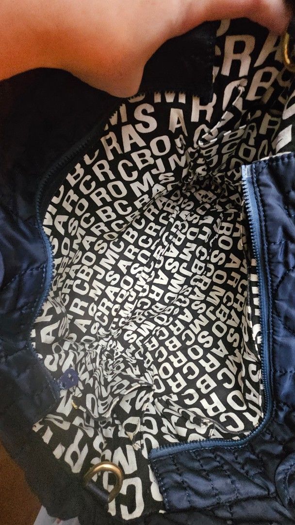 Authentic Rare Marc Jacobs Quilted Tote Bag Navy Blue (Category: Luxury Bags & Wallets) located in Makati City. Submitted by mrsdm (Listing ID 1445247897, Image 2). Description: - Versatile Bag - Signature "MJ" quilting pattern all over - Interior lining with repeating Marc Jacobs logo print - Gold-tone plaque on front engraved "Marc Jacobs Standard Supply Type: Workwear" - Matching quilted handles - Plenty of interior space.