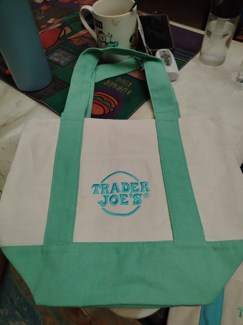 Authentic Trade Joe's Mini Pastel Canvas Tote Bag (Category: Tote Bags) located in Pasig City. Submitted by eyakk (Listing ID 1445244018, Image 2). Description: Trader Joe's Mini Pastel Canvas Tote Bag limited edition (US bought) Available Colors: Light Blue, Lavender, Mint Green Made in Vietnam Designed for Durability: At least 125 uses Ideal for: Groceries, everyday essentials.