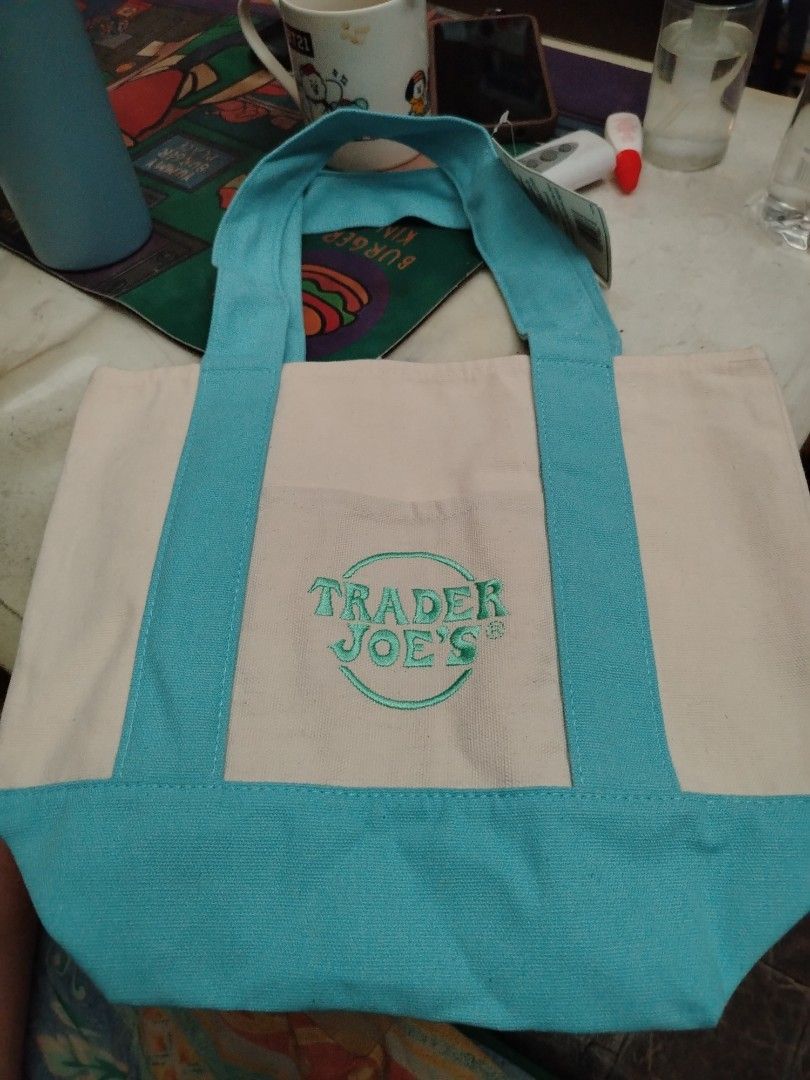 Authentic Trade Joe's Mini Pastel Canvas Tote Bag (Category: Tote Bags) located in Pasig City. Submitted by eyakk (Listing ID 1445244018, Image 3). Description: Trader Joe's Mini Pastel Canvas Tote Bag limited edition (US bought) Available Colors: Light Blue, Lavender, Mint Green Made in Vietnam Designed for Durability: At least 125 uses Ideal for: Groceries, everyday essentials.