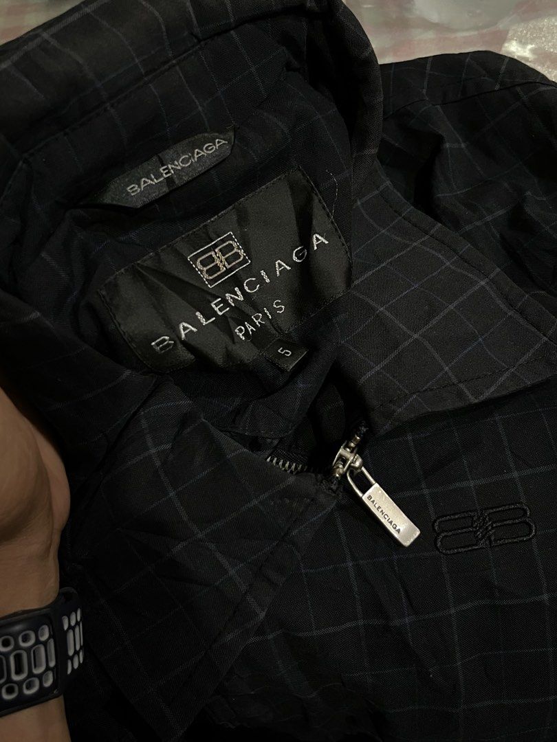 Balenciaga Paris Checkered Bomber Jacket (Category: Coats, Jackets and Outerwear) located in Davao. Submitted by streetsight (Listing ID 1445359082, Image 2). Description: -authentic Ciaga, What you see is what you get - Balenciaga Paris checkered jacket - Size 5 - Zip-up front with silver zipper pull - Balenciaga logo on zipper pull - Embroidered Balenciaga logo on chest - Ideal for layering.