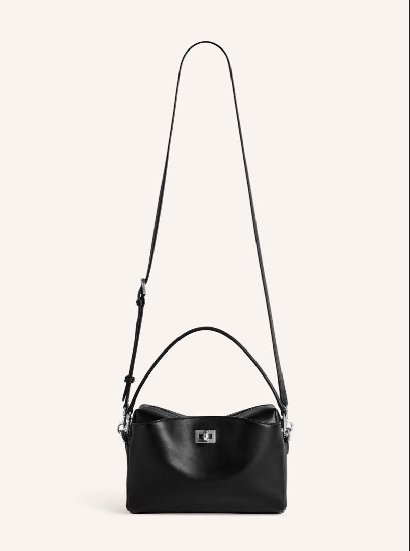 Balenciaga Rodeo Camera Bag (Category: Luxury Bags & Wallets) located in Davao. Submitted by goodstuff.149 (Listing ID 1445381610, Image 2). Description: ‼️MANILA ON-HAND‼️ Balenciaga Rodeo Camera Bag Product Details - Smooth calfskin material - One removable handle - Adjustable and removable strap - Crossbody, shoulder and hand carry - Front pocket at front with turn lock closure - Balenciaga logo engraved at front - Aged-silver hardware - Zippe