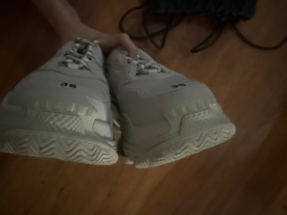 Balenciaga Triple S Sneakers Size 38 (Category: Sneakers) located in Pasig City. Submitted by npl123 (Listing ID 1445301608, Image 2). Description: - Balenciaga Triple S Sneakers - Color: Light Beige - Size: 38 - Features: Iconic chunky design, signature layered sole - Branding: Balenciaga logo on side and sole - Detail: Size '38' visible on toe box - Style: Ideal for everyday wear.