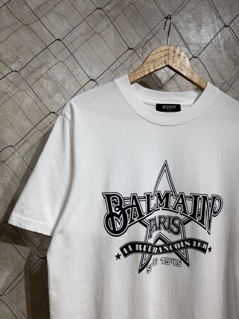 Balmain Paris T-Shirt White (Category: Tshirts & Polo Shirts ) located in Manila. Submitted by ardobe.mnl (Listing ID 1445371823, Image 2). Description: Balmain Star Logo White Tee. Size: Large Dimes: 22x29 Condition: Good asnew Flaw: None! Dm for more inquiries! 😇.