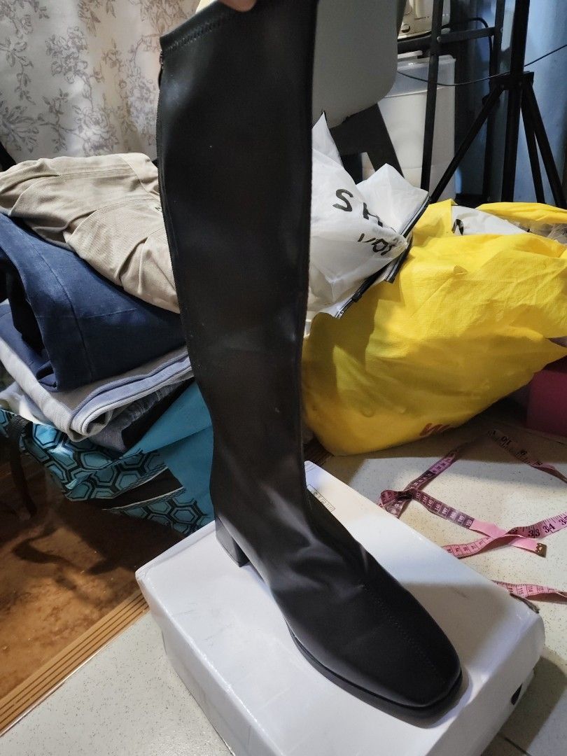 Black Knee-High Boots Size 40 (Category: Boots) located in Manila. Submitted by jenna181623 (Listing ID 1445258851, Image 2). Description: - Black knee-high boots - Square toe design - Low block heel - Marked size 40. 25 CM - Shaft measures approx. 16 inches from sole - Versatile for everyday or dressy occasions.