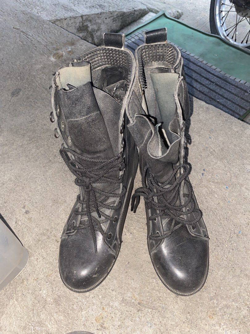 Black Leather Lace-Up Combat Boots with Side Zipper (Category: Boots) located in Pasay City. Submitted by 4zalea (Listing ID 1445333060, Image 2). Description: - Black leather mid-calf boots - Lace-up front with convenient side zipper - Soles appear sturdy and durable - Versatile for everyday wear or as a fashion statement.