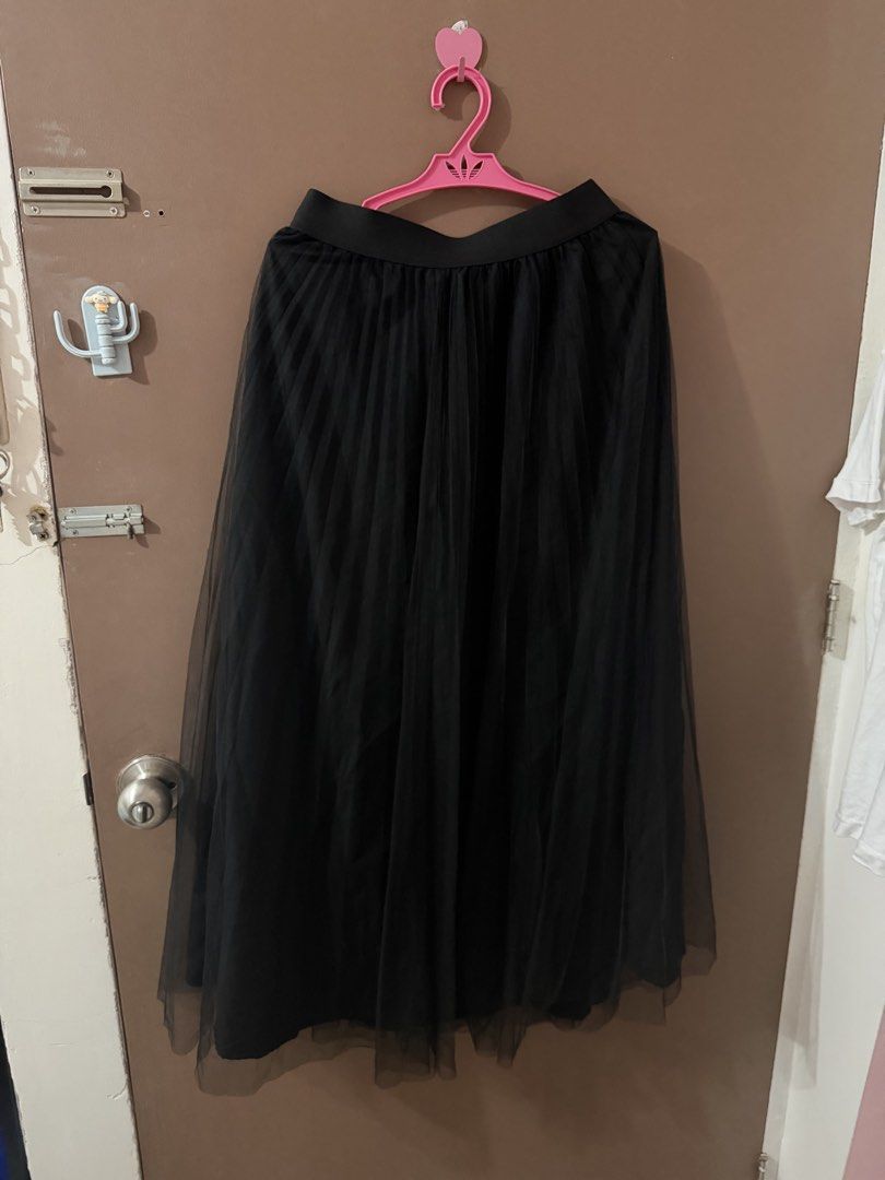 Black Pleated Tulle Maxi Skirt (Category: Skirts) located in Davao. Submitted by fabdeclutter (Listing ID 1445415459, Image 1). Description: - Flowy black tulle fabric - Elegant pleated design - Comfortable elastic waistband - Versatile for dressing up or down - Ideal for parties, casual outings, or pairing with a simple top.