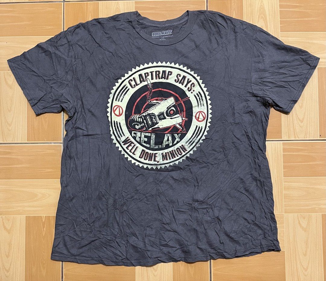 Borderland "Claptrap says: Well done, Minion" Tshirt (Category: Tshirts & Polo Shirts ) located in Pasig City. Submitted by gt.shop06 (Listing ID 1445281165, Image 1). Description: Size on tag: 2XL Dimension: 24x28.