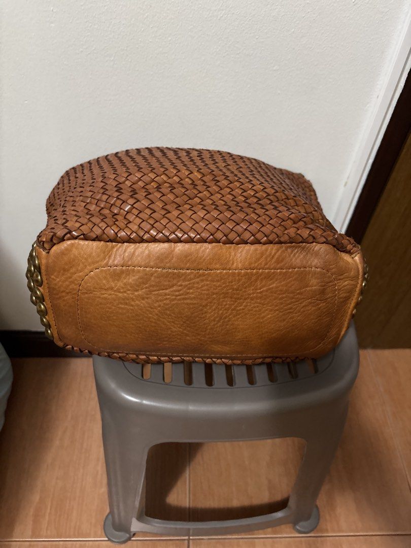 Brown Woven Leather Studded Shoulder Bag (Category: Shoulder Bags) located in Manila. Submitted by pugo_08_08_08 (Listing ID 1445251524, Image 2). Description: - Stylish cool brown woven leather bag - Features decorative studs along top and bottom edges - Secure zipper closure - Durable leather straps - Spacious interior for all your essentials - Ideal for everyday use.