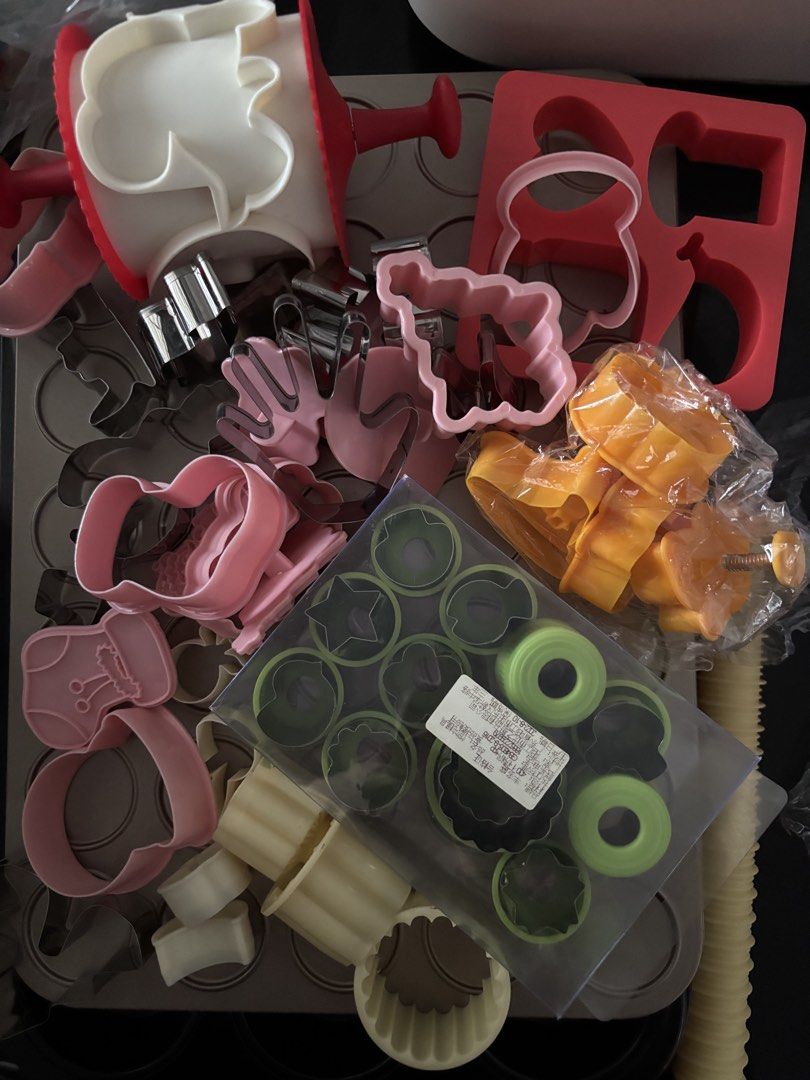 Assorted baking tools (Category: Bakeware) located in Singapore. Submitted by samuelevan (Listing ID 1445238348, Image 2). Description: baking tools suitable for beginners - Includes: Purple cake turntable, purple dough scraper, long metal spatula - $8 (BN) - Perfect for cake and pastry decorating - assorted cookie cutters, suitable for all occasions eg cny, Christmas, Halloween, kids cookies, bento making etc. - $10 - macaron gauge tray (used on