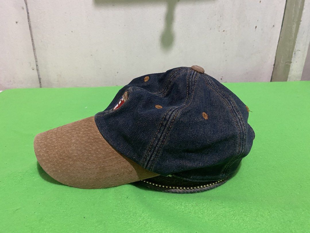 Carven Jeans Denim & Suede Baseball Cap (Category: Caps & Hats) located in Manila. Submitted by resi.diaz (Listing ID 1445399060, Image 3). Description: - Stylish Carven Jeans cap - Dark denim with a brown suede brim - Features the iconic Carven logo on the front - 'CARVEN JEANS' embroidered on the back - Adjustable strap with a buckle closure for a perfect fit - Ideal for adding a cool touch to your casual outfits.