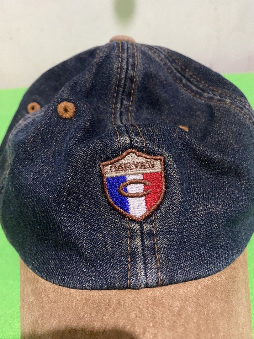 Carven Jeans Denim & Suede Baseball Cap (Category: Caps & Hats) located in Manila. Submitted by resi.diaz (Listing ID 1445399060, Image 2). Description: - Stylish Carven Jeans cap - Dark denim with a brown suede brim - Features the iconic Carven logo on the front - 'CARVEN JEANS' embroidered on the back - Adjustable strap with a buckle closure for a perfect fit - Ideal for adding a cool touch to your casual outfits.