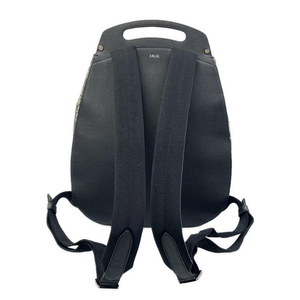 Christian Dior Dior / Leather Backpack (Category: Luxury Bags & Wallets) located in Las Pinas. Submitted by daisuki_japan_luxury_by_reiko (Listing ID 1445351946, Image 2). Description: Condition Notes [Exterior] Overall: Scratches / Stains / Discoloration / Fading (some discoloration) / Loss of shape (inner core deterioration on the front) / Hardware deterioration ; Main opening: Corner scuffs / Fabric deterioration (slight cracking in the varnis