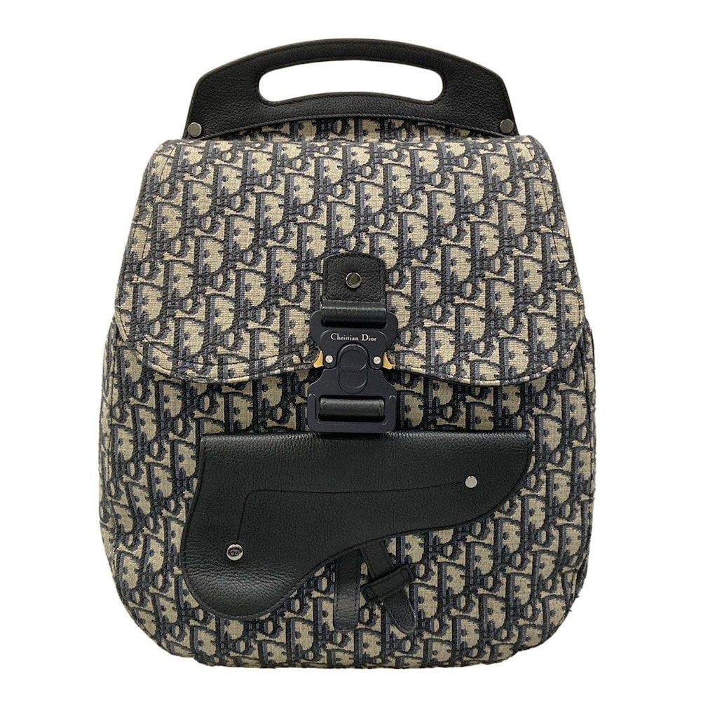 Christian Dior Dior / Leather Backpack (Category: Luxury Bags & Wallets) located in Las Pinas. Submitted by daisuki_japan_luxury_by_reiko (Listing ID 1445351946, Image 1). Description: Condition Notes [Exterior] Overall: Scratches / Stains / Discoloration / Fading (some discoloration) / Loss of shape (inner core deterioration on the front) / Hardware deterioration ; Main opening: Corner scuffs / Fabric deterioration (slight cracking in the varnis