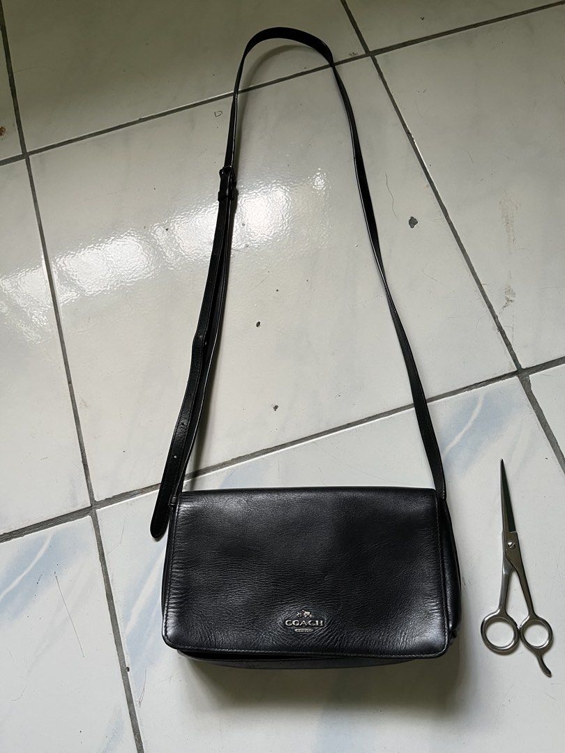 Coach Black Leather Shoulder Bag (Category: Luxury Bags & Wallets) located in Manila. Submitted by mamichell19537 (Listing ID 1445270175, Image 1). Description: - Brand: Coach - Material: Black Leather - Origin: Made in Vietnam - Closure: Magnetic Snap - Interior: Lined - Strap: Adjustable - Style: Classic, perfect for everyday use - Condition: Shows some signs of wear on the leather.