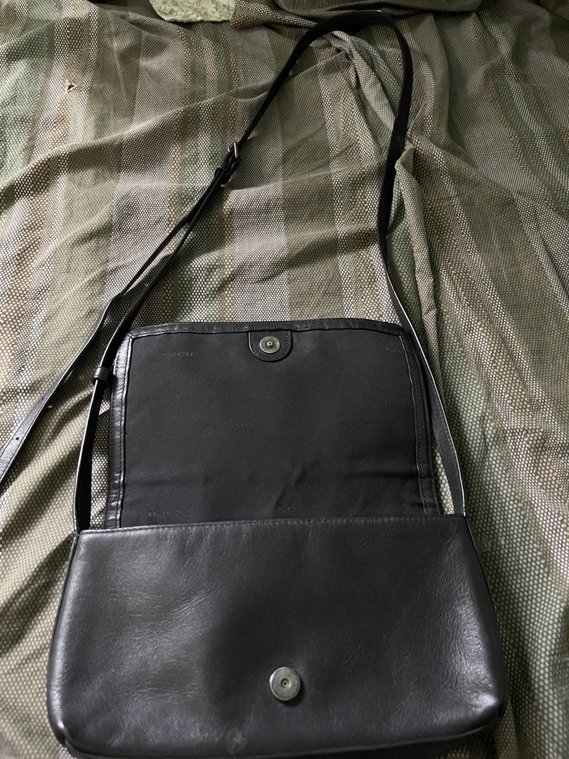 Coach Black Leather Shoulder Bag (Category: Luxury Bags & Wallets) located in Manila. Submitted by mamichell19537 (Listing ID 1445270175, Image 2). Description: - Brand: Coach - Material: Black Leather - Origin: Made in Vietnam - Closure: Magnetic Snap - Interior: Lined - Strap: Adjustable - Style: Classic, perfect for everyday use - Condition: Shows some signs of wear on the leather.