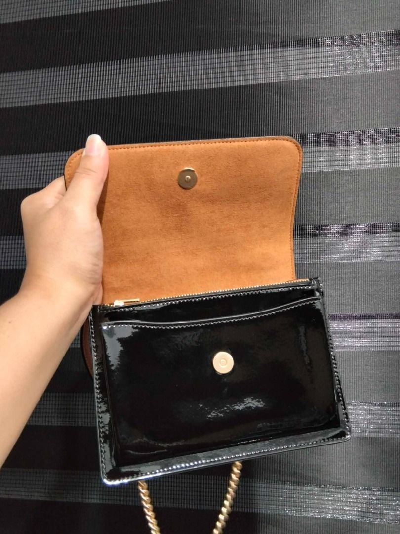 Coach Klare Mini Black Patent Leather (Category: Luxury Bags & Wallets) located in Caloocan City. Submitted by new.pheromagic (Listing ID 1439256576, Image 3). Description: Used once only In pristine condition, super like new SJDM, Bulacan Grab/Lalamove/J&t - Coach shoulder bag - Black patent leather - Gold chain strap - Gold Coach logo - Rectangular shape with flap closure - Compact size.