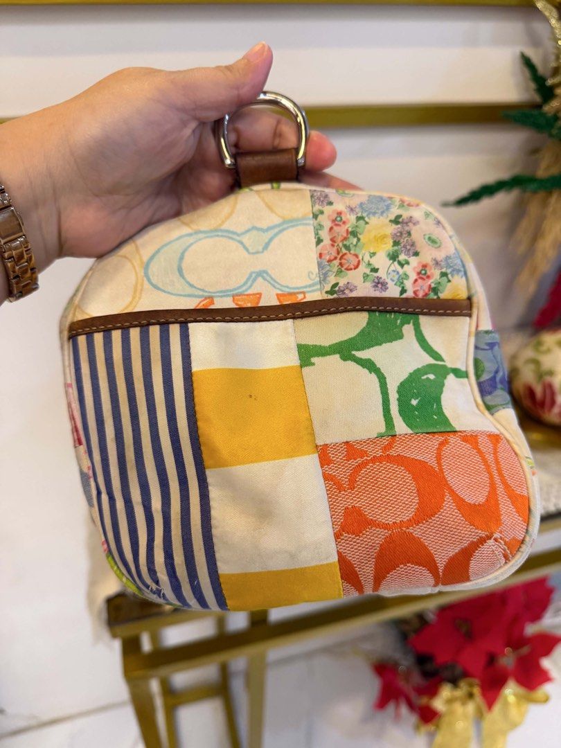 Coach Patchwork Mini Boston (Category: Luxury Bags & Wallets) located in Manila. Submitted by jiahhncarl57791 (Listing ID 1445253513, Image 3). Description: - Adorable Coach duffle bag with a unique patchwork design. - Features the iconic Coach 'C' logo combined with stylish stripes and floral prints. - Crafted with genuine leather handles and trim for a premium feel. - Secure zipper closure to keep your belongings safe. - Ideal for everyday erra