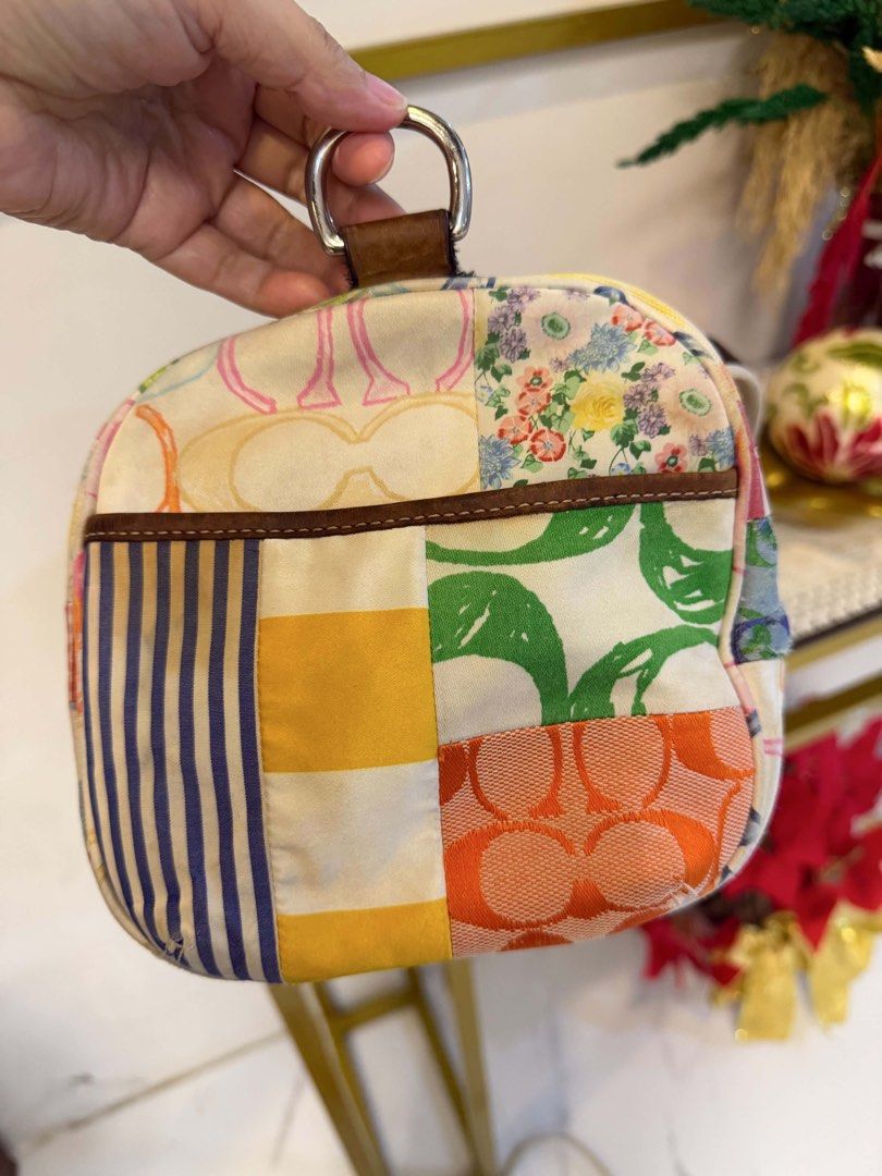 Coach Patchwork Mini Boston (Category: Luxury Bags & Wallets) located in Manila. Submitted by jiahhncarl57791 (Listing ID 1445253513, Image 2). Description: - Adorable Coach duffle bag with a unique patchwork design. - Features the iconic Coach 'C' logo combined with stylish stripes and floral prints. - Crafted with genuine leather handles and trim for a premium feel. - Secure zipper closure to keep your belongings safe. - Ideal for everyday erra