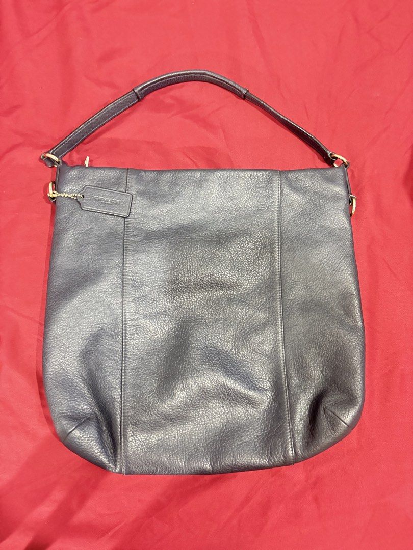 Coach Pebbled Leather Hobo Shoulder Bag (Category: Luxury Bags & Wallets) located in Los Banos. Submitted by tripleceedoubletwo (Listing ID 1445339710, Image 2). Description: - Dark navy blue pebbled leather Coach hobo - clean Interior and slip pockets - Issue: loose thread (see last pic) - length: 14 inch, height 13 inch - MOP: Gcash/ BPI.