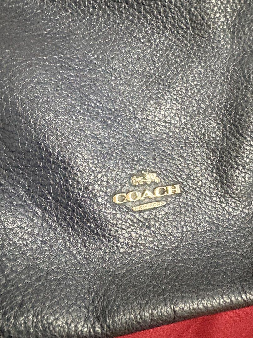 Coach Pebbled Leather Hobo Shoulder Bag (Category: Luxury Bags & Wallets) located in Los Banos. Submitted by tripleceedoubletwo (Listing ID 1445339710, Image 3). Description: - Dark navy blue pebbled leather Coach hobo - clean Interior and slip pockets - Issue: loose thread (see last pic) - length: 14 inch, height 13 inch - MOP: Gcash/ BPI.