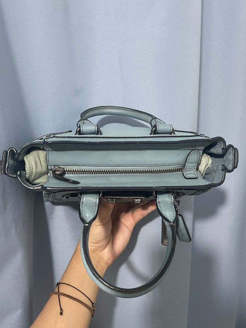 Mini Coach Swagger 20 (Category: Luxury Bags & Wallets) located in Cavite. Submitted by lengthingz (Listing ID 1445238114, Image 3). Description: DETAILS: NO:36235 2 hang tags Pebble leather Inside zip and multifunction pockets Zip-top closure, fabric lining Handles with 7.7cm drop Long strap with 58.5cm drop for shoulder or crossbody wear Size :20cm (L) x14.5cm (H) × 10cm (W) - Item Location: Imus, Cavite see pics for flaws rfs: too many bags :)