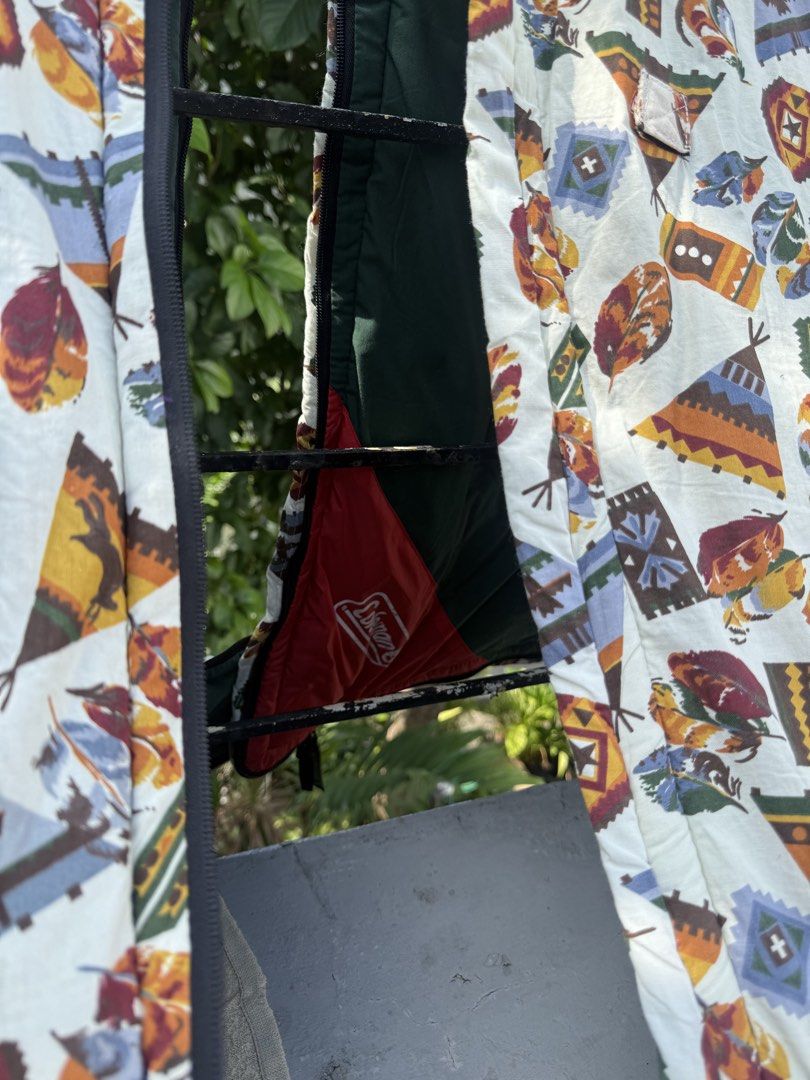 Coleman Sleeping Bag - Native American Tribal Pattern (Category: Hiking & Camping) located in Manila. Submitted by oldstuff2308 (Listing ID 1445334322, Image 2). Description: - Unique Native American tribal print featuring teepees, feathers, and geometric designs. - Solid olive green outer shell. - Smoothly zipping closure. - Perfect for camping trips or sleepovers. - Ready for your next adventure!.
