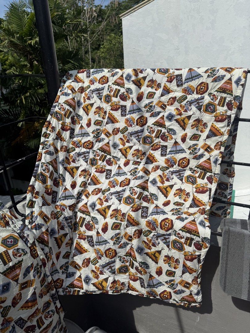 Coleman Sleeping Bag - Native American Tribal Pattern (Category: Hiking & Camping) located in Manila. Submitted by oldstuff2308 (Listing ID 1445334322, Image 3). Description: - Unique Native American tribal print featuring teepees, feathers, and geometric designs. - Solid olive green outer shell. - Smoothly zipping closure. - Perfect for camping trips or sleepovers. - Ready for your next adventure!.