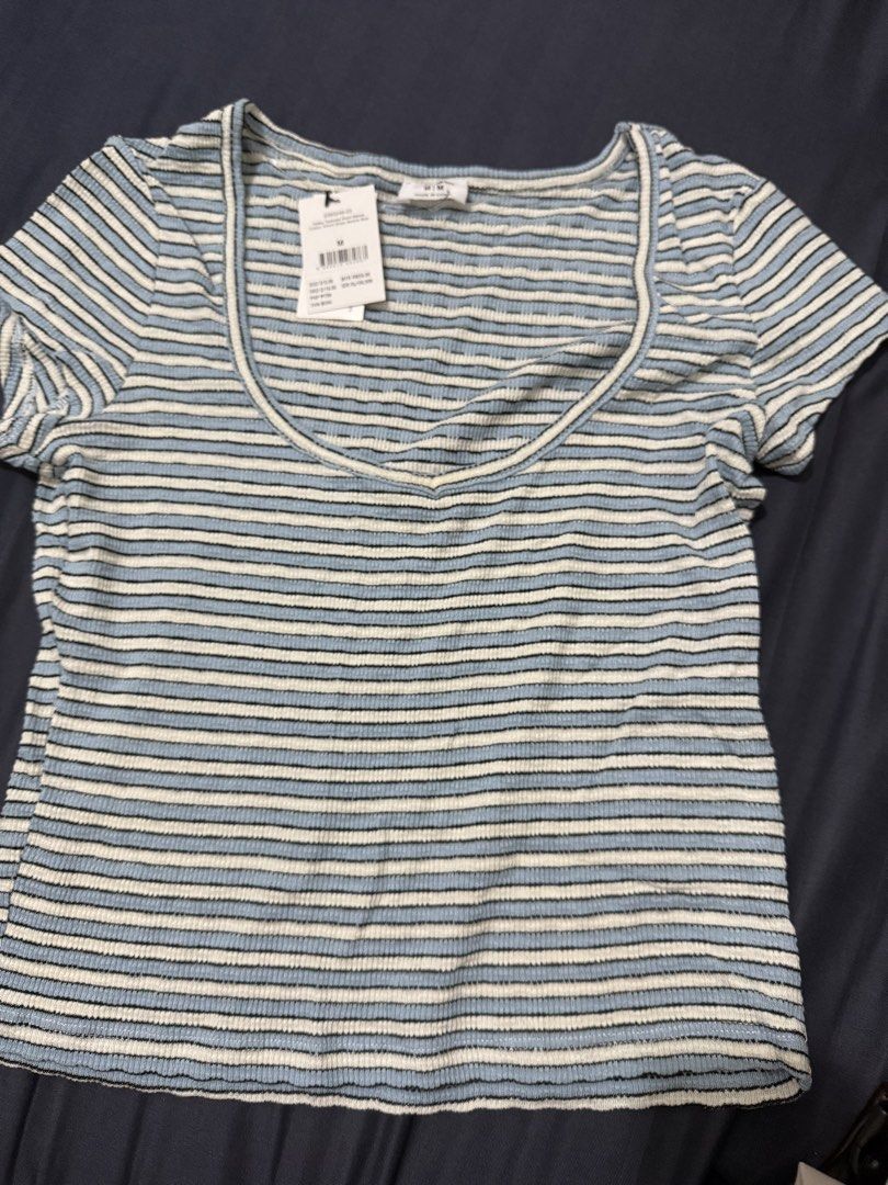 Cotton On Striped Ribbed Square Neck Top Size M (Category: Blouses) located in Orani. Submitted by keyychain (Listing ID 1445339077, Image 2). Description: - Brand: Cotton On - Color: Blue and white stripes - Material: Ribbed fabric - Neckline: Square - Sleeves: Short - Condition: Brand new with tag - Size: Medium (M).