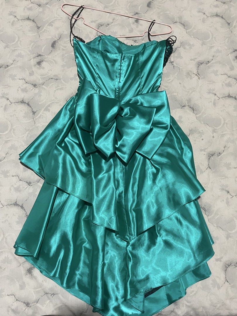 Crazy Rich Asians Inspired Dress (Category: Dresses) located in Manila. Submitted by stargirl05 (Listing ID 1445381277, Image 3). Description: Strapless sequin bodice Boned, lined bodice Straight across neckline Black sparkly metallic top Teal blue green sequins Center back zipper Basque waist, gathered skirt Criss cross cummerbund Back loop bow, snap Two tiered full skirt Pointed in front, raised sides True full circle skirt Tulle layer under fu